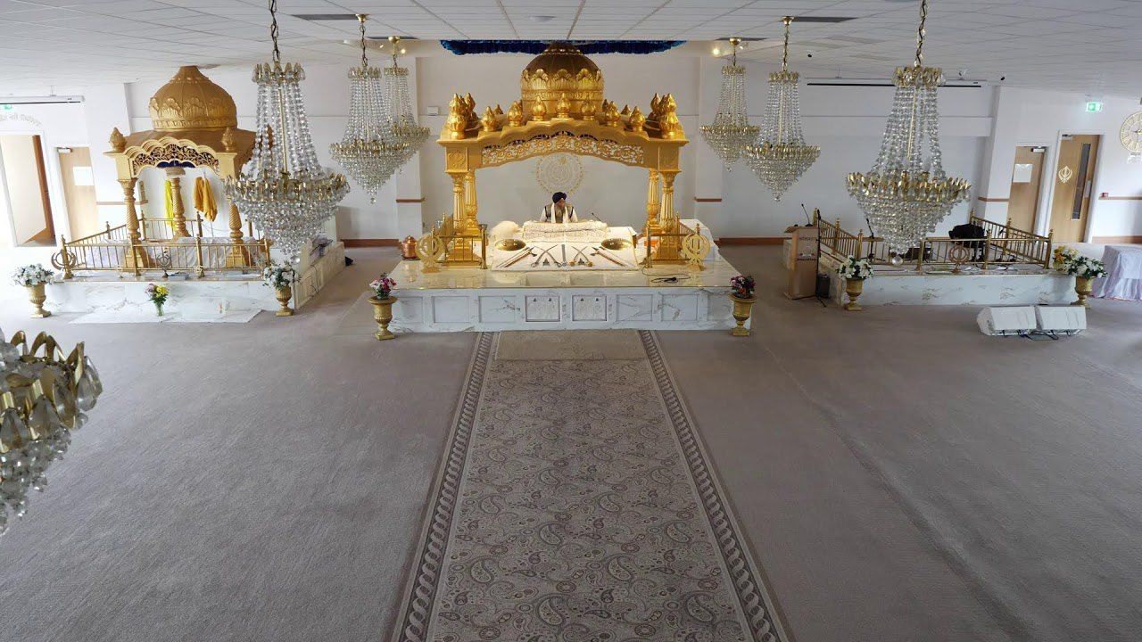 Darbar Sahib No 1, the main hall upstairs, with the Palki Sahib and chandeliers